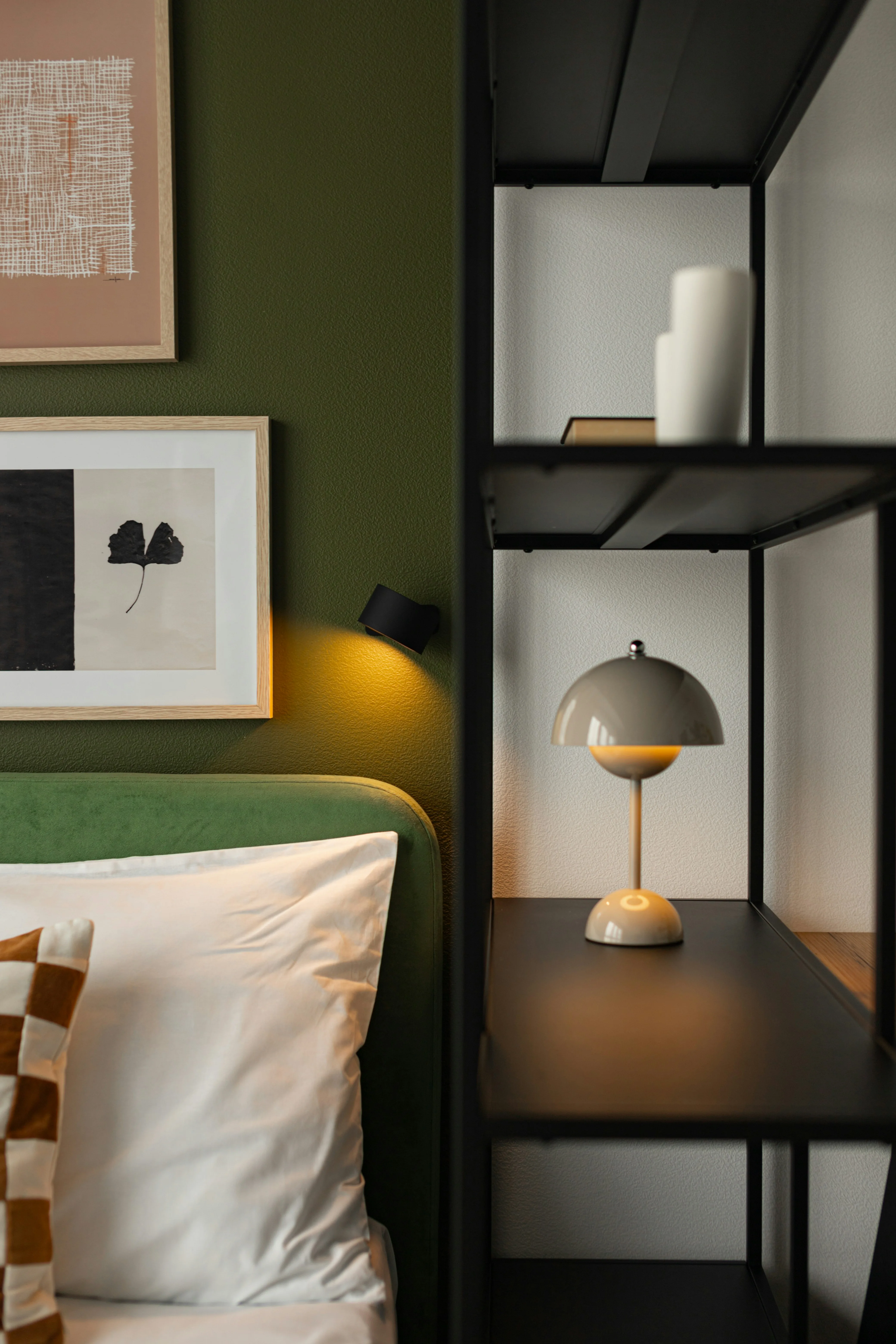 Hotel room with minimalist furniture and bold color accents